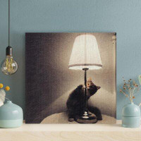 Latitude Run® Long-Fur Brown Cat Beside White Table Lamp - 1 Piece Square Graphic Art Print On Wrapped Canvas