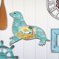 The Holiday Aisle® Sea Lion Scenic Wooden Decorative Door Hanger
