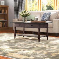 Charlton Home Tuoi Solid Wood Coffee Table with Storage