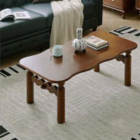 Canora Grey French style wave shape solid wood coffee table.