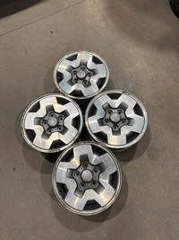 Four used 15 inch aluminum  wheels from older style Chevrolet S10 Blazer