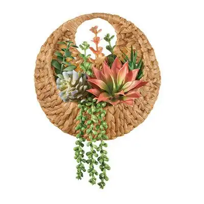 A beautiful woven rattan basket overflows with faux succulents in a variety of colors and textures....