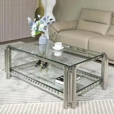 This striking coffee table combines irregular cylindrical legs and a tempered glass top into a gorge...