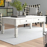 August Grove Haynie 4 Legs Coffee Table with Storage
