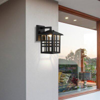 Longshore Tides Coman Black 10.5'' H Integrated LED Outdoor Wall Lantern with Dusk to Dawn