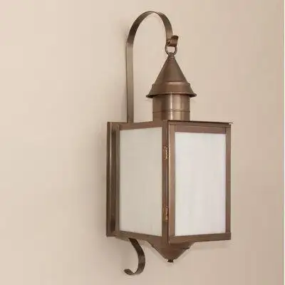 This outdoor wall lantern is a classic addition to any yard design. This fixture features a handspun...