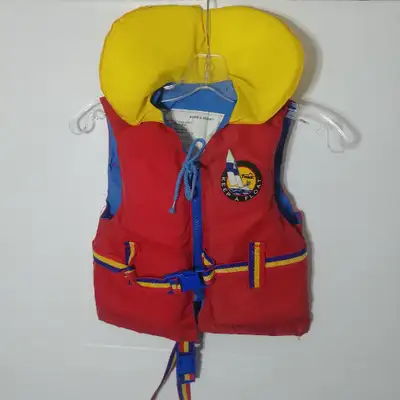 A red and yellow youth PFD built for youths 14 to 27 KG, by Keep-A-Float. All around in good conditi...