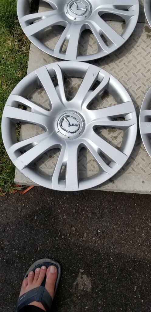 MAZDA    FACTORY OEM 15 INCH WHEEL COVER SET OF FOUR IN GOOD   CONDITION in Tires & Rims in Ontario - Image 2