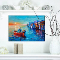 East Urban Home Nautical 'Fishing Boat in Coastal Town' Print on Wrapped Canvas