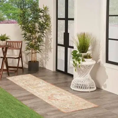 Add timeless style to your porch patio or deck with this beige and rust Persian style rug from the S...