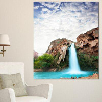 Design Art 'Amazing Waterfall Under Cloudy Sky' Photographic Print on Wrapped Canvas