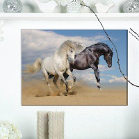 Made in Canada - East Urban Home White and Black Horses Galloping in Desert - Wrapped Canvas Photograph Print