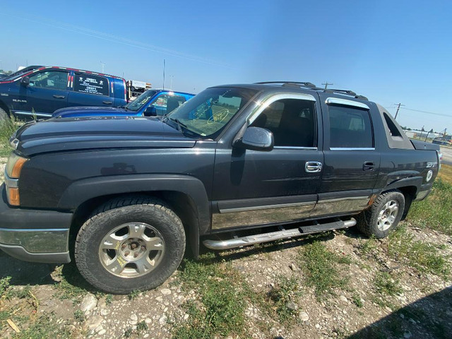 265/70R17  Set of 4 rims and tires that  come off from a 2004 CHEVROLET AVALANCHE. in Auto Body Parts in Calgary - Image 2