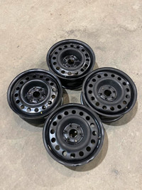 Four used 17 inch x 7 wide 6x120 bolt pattern black steel wheels