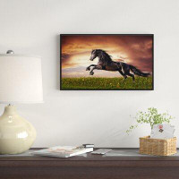East Urban Home 'Black Friesian Horse Gallop' Framed Photographic Print on Wrapped Canvas