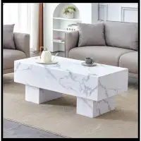 Latitude Run® The coffee table has patterns. Modern rectangular table