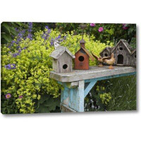 August Grove Bird Houses on Bench by Don Paulson - Photograph Print on Canvas