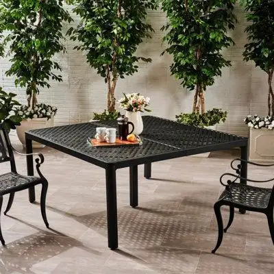 TRADITIONAL INSPIRATION: Featuring a metal weave tabletop this dining table borrows aspects of tradi...