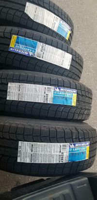 BRAND NEW WITH LABELS HIGH PERFORMANCE  MICHELIN  215 / 70 / 16  WINTER  TIRE SET OF     FOUR.