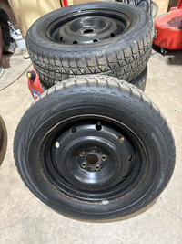 Four 225/60R16 Bridgestone Blizzak Winter Tires on Steel Wheels