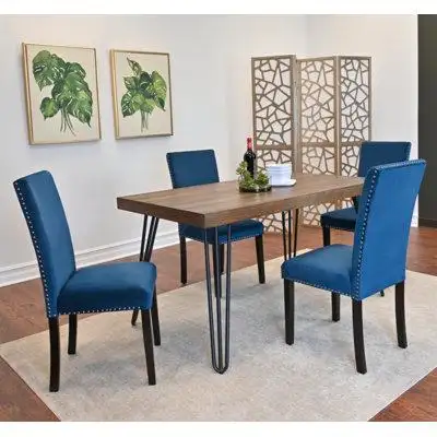 The set includes a spacious dining table and four comfortable chairs providing ample seating for fam...