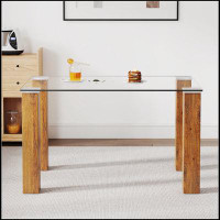 Ebern Designs Modern minimalist rectangular dining table. Glass desktop and wooden MDF table legs