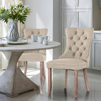 Lark Manor Albrah Tufted Faux Leather Wing Back Dining Chair