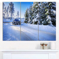 Design Art 'SUV Car Though Snowy Winter' Photographic Print Multi-Piece Image on Canvas