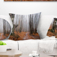 Made in Canada - East Urban Home Forest Road Covered by Fallen Leaves Pillow