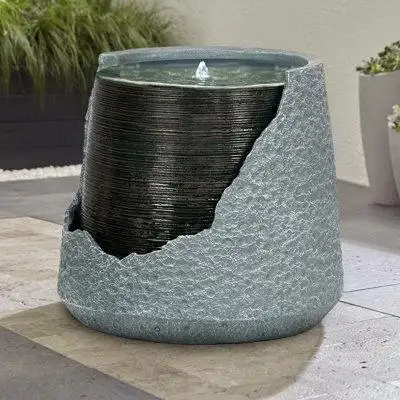 This striking piece features a unique broken urn design that adds a touch of modern elegance to any...