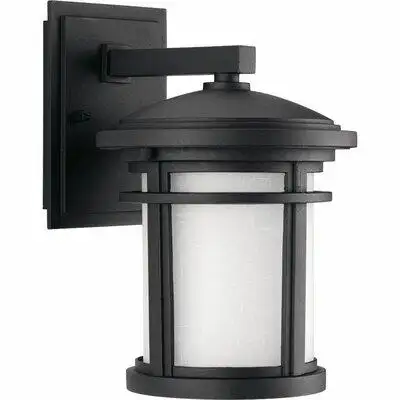Small wall lantern with etched linen glass. Includes dark sky shield for full cut-off illumination o...