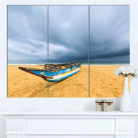 Design Art 'Fishing Boat On Beach with Dark Clouds' 3 Piece Photographic Print on Wrapped Canvas Set