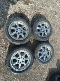 275/55R20  Set of 4 rims and tires that  come off from a 2006 CHEVROLET AVALANCHE.
