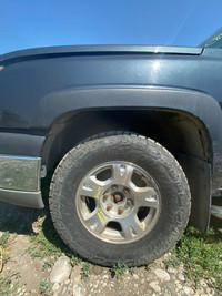 265/70R17  Set of 4 rims and tires that  come off from a 2004 CHEVROLET AVALANCHE.