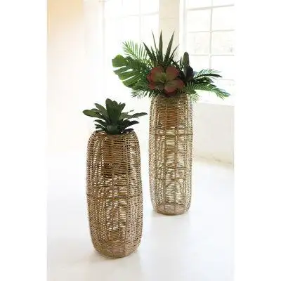 Weave these seagrass barrel planters into your sunroom decor. These Haitian-made woven barrel plante...