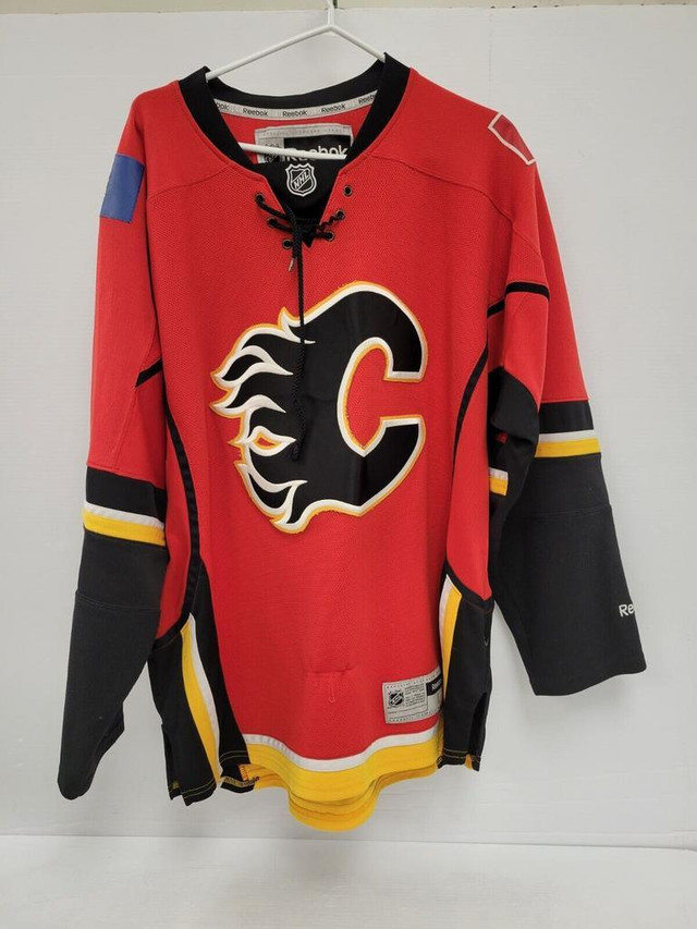 (39910-2) Reebok Calgary Flames Jersey - Size Large in Hockey in Alberta