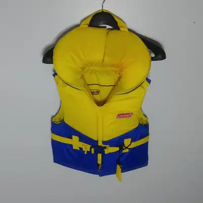 A bright blue and yellow PFD featuring a whistle, by Coleman. Size B, 27-41KG (60-90 Ibs) All around...
