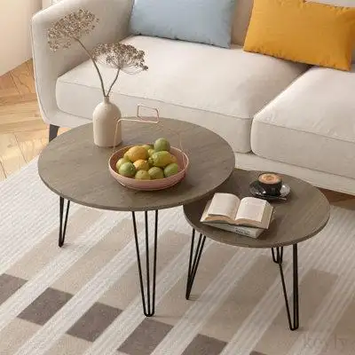 With the practical nesting design you can pair these coffee tables together to create a visually air...