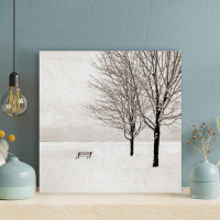 Red Barrel Studio A Chair On Snow Ground Near A Tree - 1 Piece Square Graphic Art Print On Wrapped Canvas