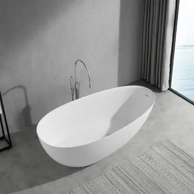 This sleek modern bathtub creates a striking focal point that is evocative of modern luxury. The dra...