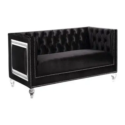 Black velvet upholstery begins a glam look to the loveseat and delivers a stylish parlour motif perf...