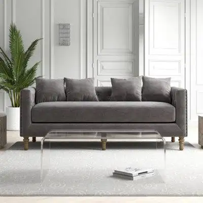 This sofa is a distinct sofa set that intersects the mid-century and today. This sofa features a tuf...