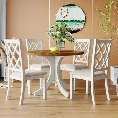 Complete with 4 dining chairs and 1 round dining table this dining table set is perfect for seating...