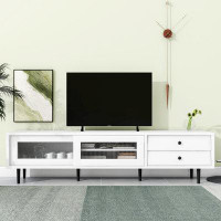 Ebern Designs TV Stand with Sliding Fluted Glass Doors Slanted Drawers Media Console