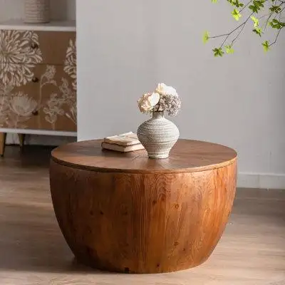 This vintage barrel shaped coffee table has a top and side made of high-quality fir wood while the b...