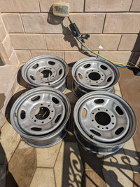 BRAND NEW TAKE OFF  FORD F250 / 350 FACTORY OEM  17  INCH  STEEL  WHEEL SET OF FOUR     WITH  SENSORS. NO CAPS