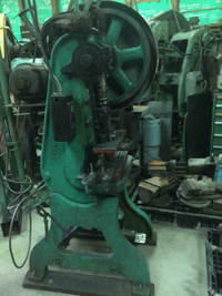 12 ton OBI punch press with hand pullback safety straps.,
