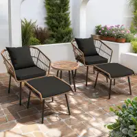 Ebern Designs 5 Pcs of Patio Furniture with 2 Beige Rattan Chairs, 2 Ottomans, Coffee Table, and Black Cushions