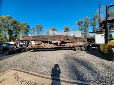 Good quality solid fur 48 Foot trusses and 30 foot heavy metal roofing FOR SALE Call or text Jason a...