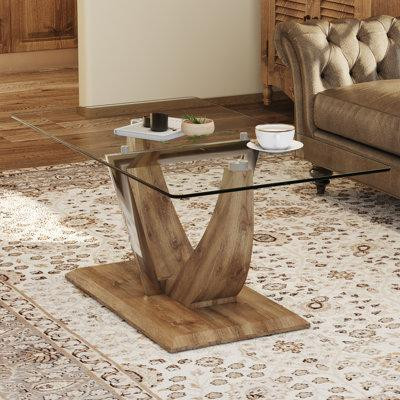 Mercer41 Modern Minimalist Transparent Tempered Glass Coffee Table With Wooden MDF Legs And Stainless Steel Decorative C in Desks
